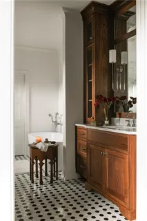 a room with table chairs and mirrors