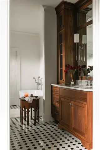 a room with table chairs and mirrors