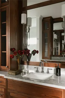 a view of a living room with bathroom