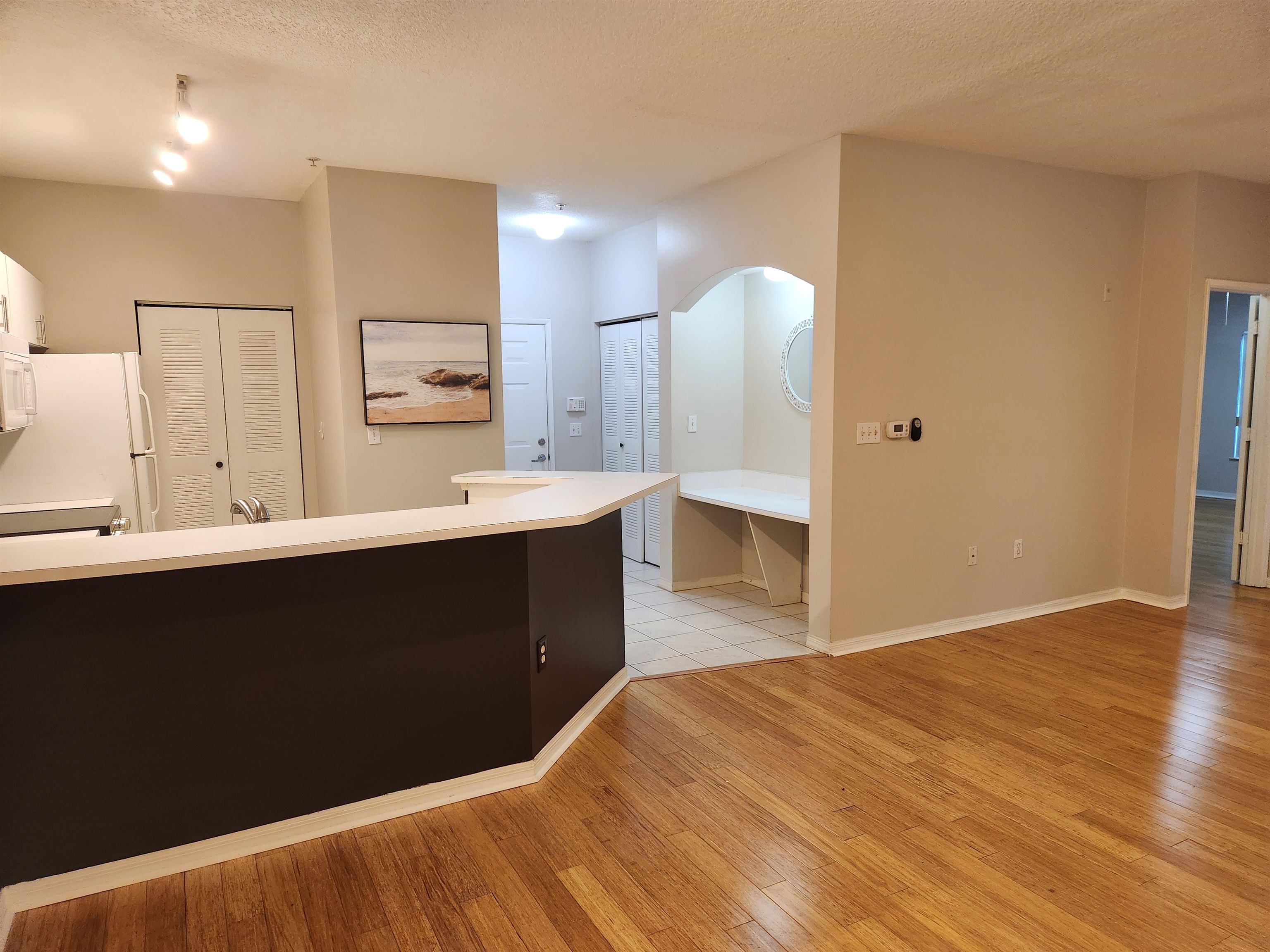 510 Florida Club Boulevard, Unit 101 St. Augustine, FL 32084 - Photo 11 of 37 a kitchen with a sink and a mirror