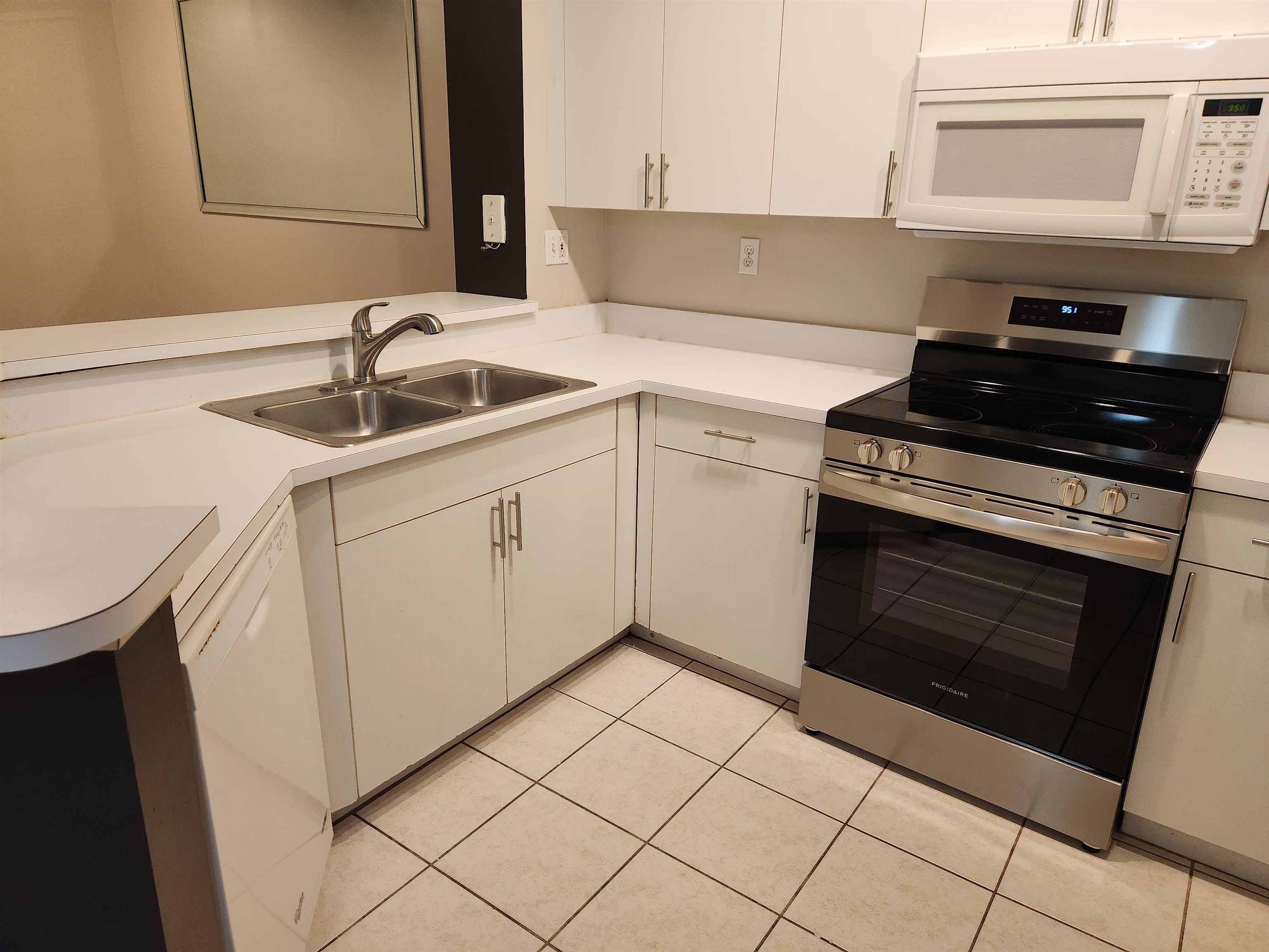 510 Florida Club Boulevard, Unit 101 St. Augustine, FL 32084 - Photo 15 of 37 a kitchen with a sink stove and cabinets