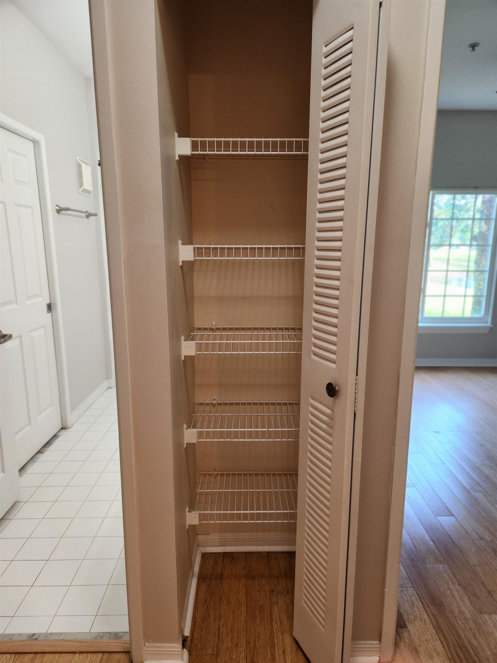 510 Florida Club Boulevard, Unit 101 St. Augustine, FL 32084 - Photo 23 of 37 a view of walk in closet with wooden floor