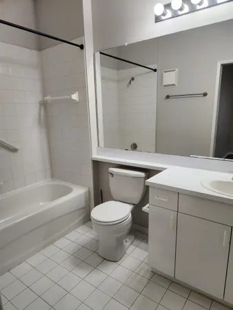 a bathroom with a sink a toilet and a bathtub