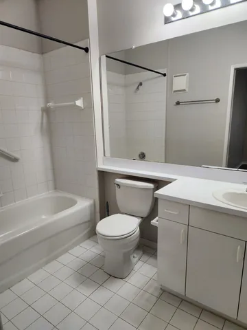 a bathroom with a sink a toilet and a bathtub