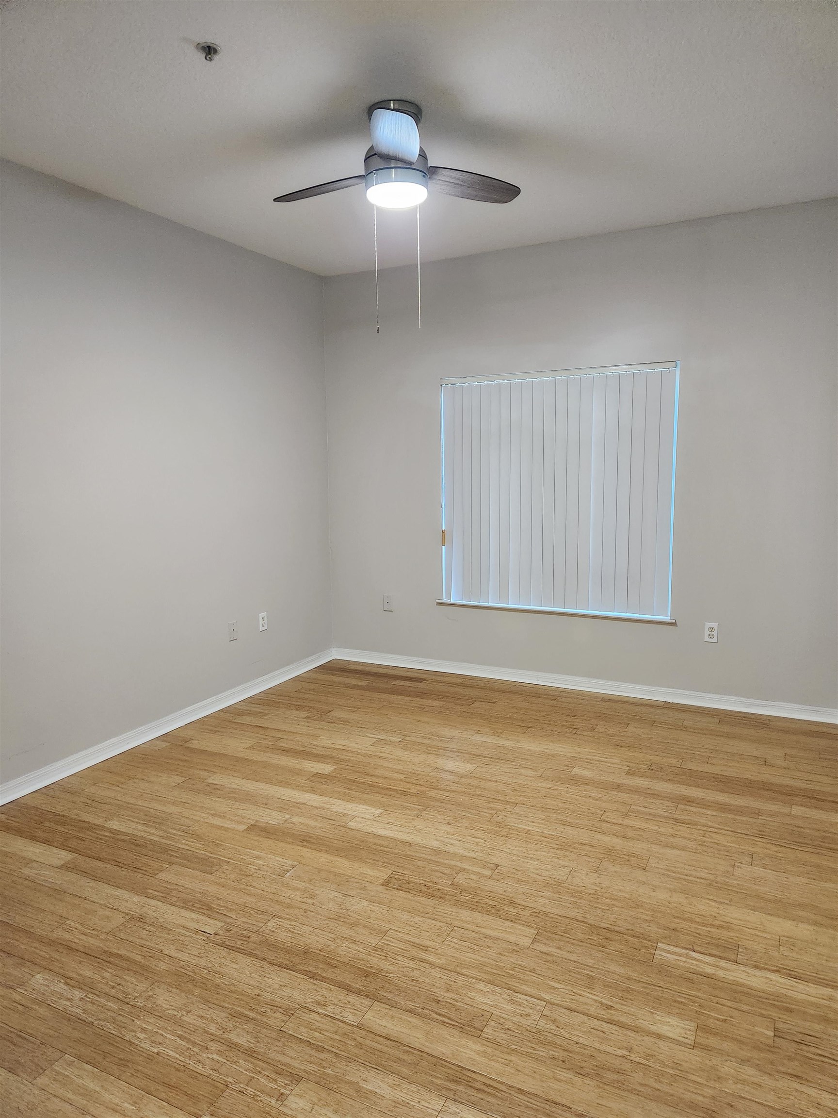 510 Florida Club Boulevard, Unit 101 St. Augustine, FL 32084 - Photo 27 of 37 a view of an empty room with wooden floor