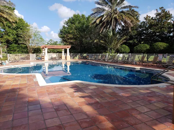 a view of a swimming pool with a patio
