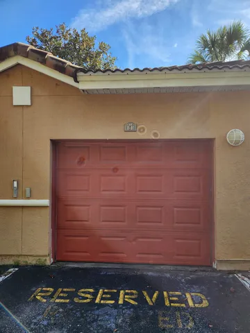 a view of water heater room with wooden floor