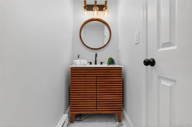 a bathroom with a sink and a mirror