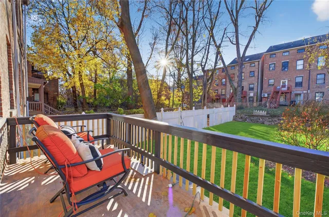 a view of a two chairs in the balcony