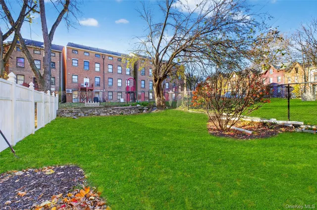 a view of a building with a yard