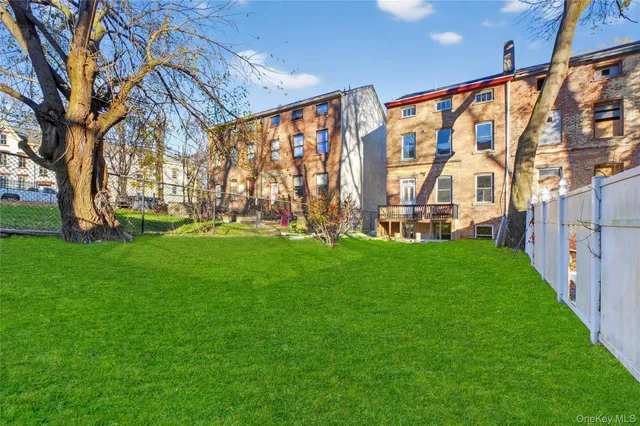 a view of yard with swimming pool