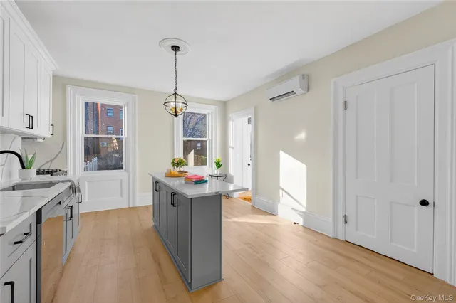 a kitchen that has a lot of cabinets in it