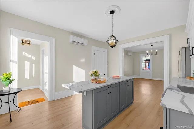 a view of a room with window and wooden floor