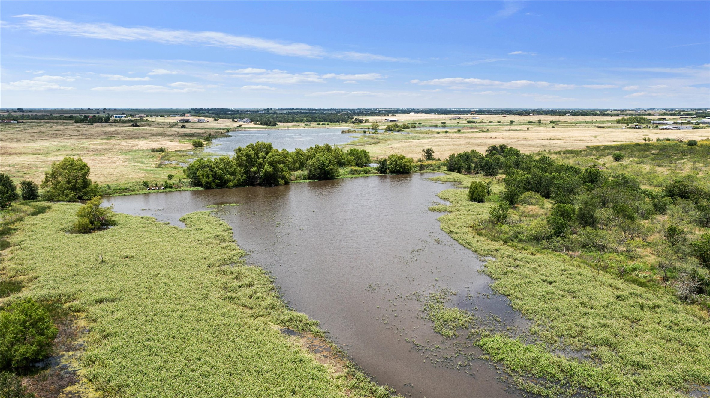 3315 County Road 463 Elgin, TX 78621 - Photo 20 of 32 Vast natural landscapes encompass this tranquil Tank, offering a serene backdrop for your future property.