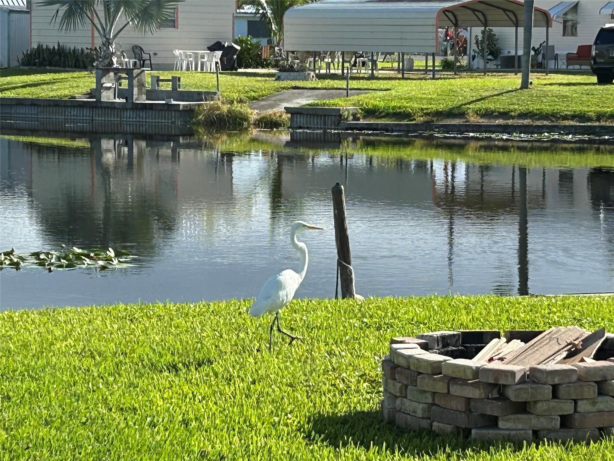 1379 Chobee Street Okeechobee, FL 34974 - Photo 11 of 13 a view of a lake with couches and chairs