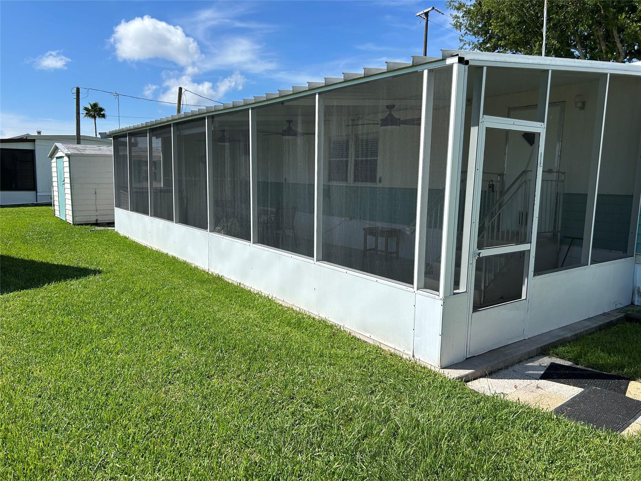 1379 Chobee Street Okeechobee, FL 34974 - Photo 2 of 13 a view of backyard with tub and garden
