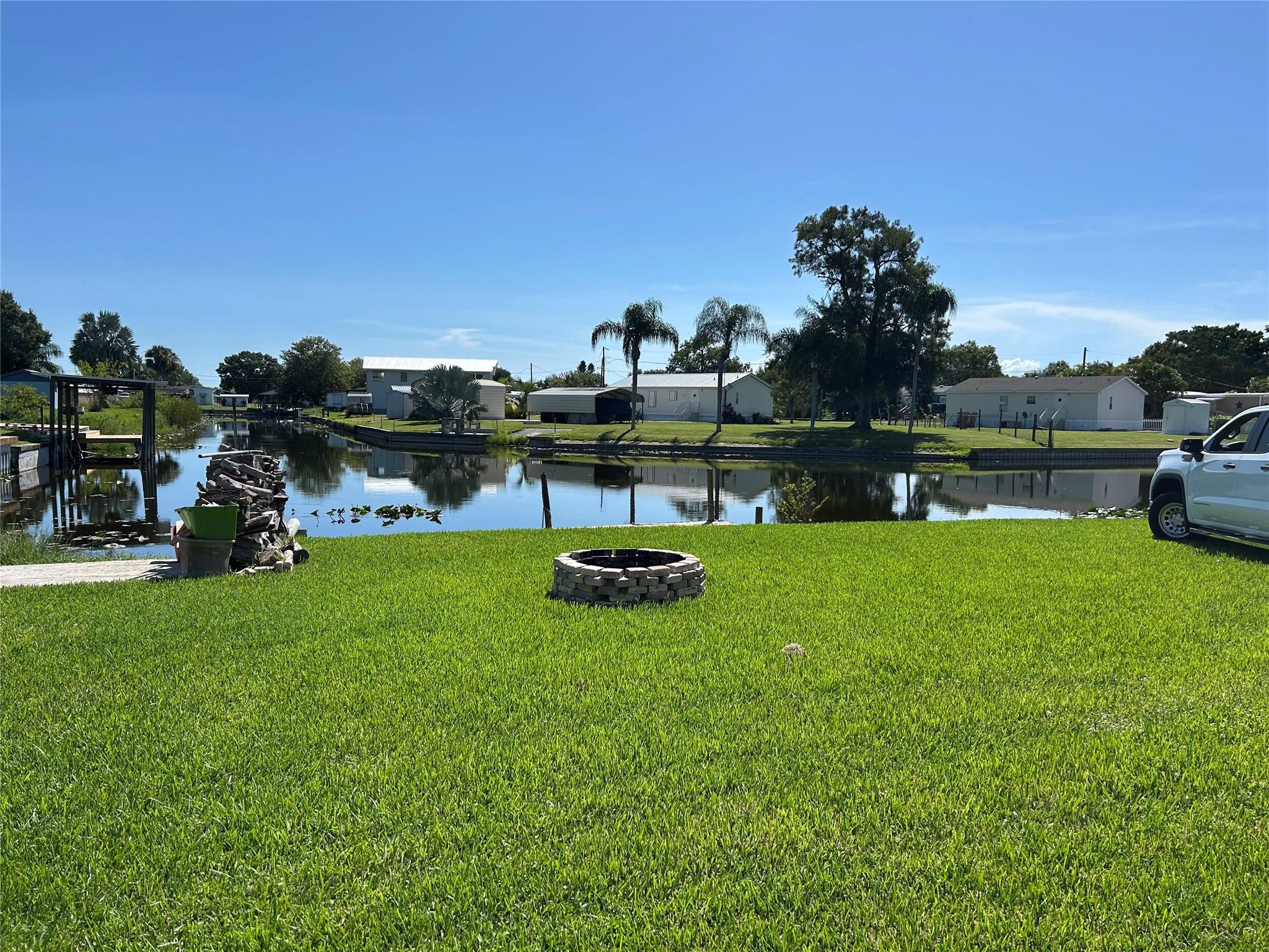 1379 Chobee Street Okeechobee, FL 34974 - Photo 3 of 13 a view of a lake with outdoor space