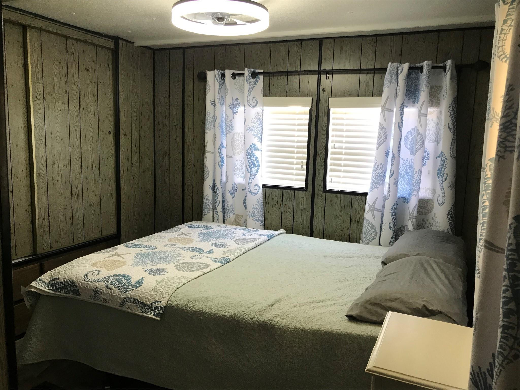 1379 Chobee Street Okeechobee, FL 34974 - Photo 8 of 13 a bedroom with a bed and a window