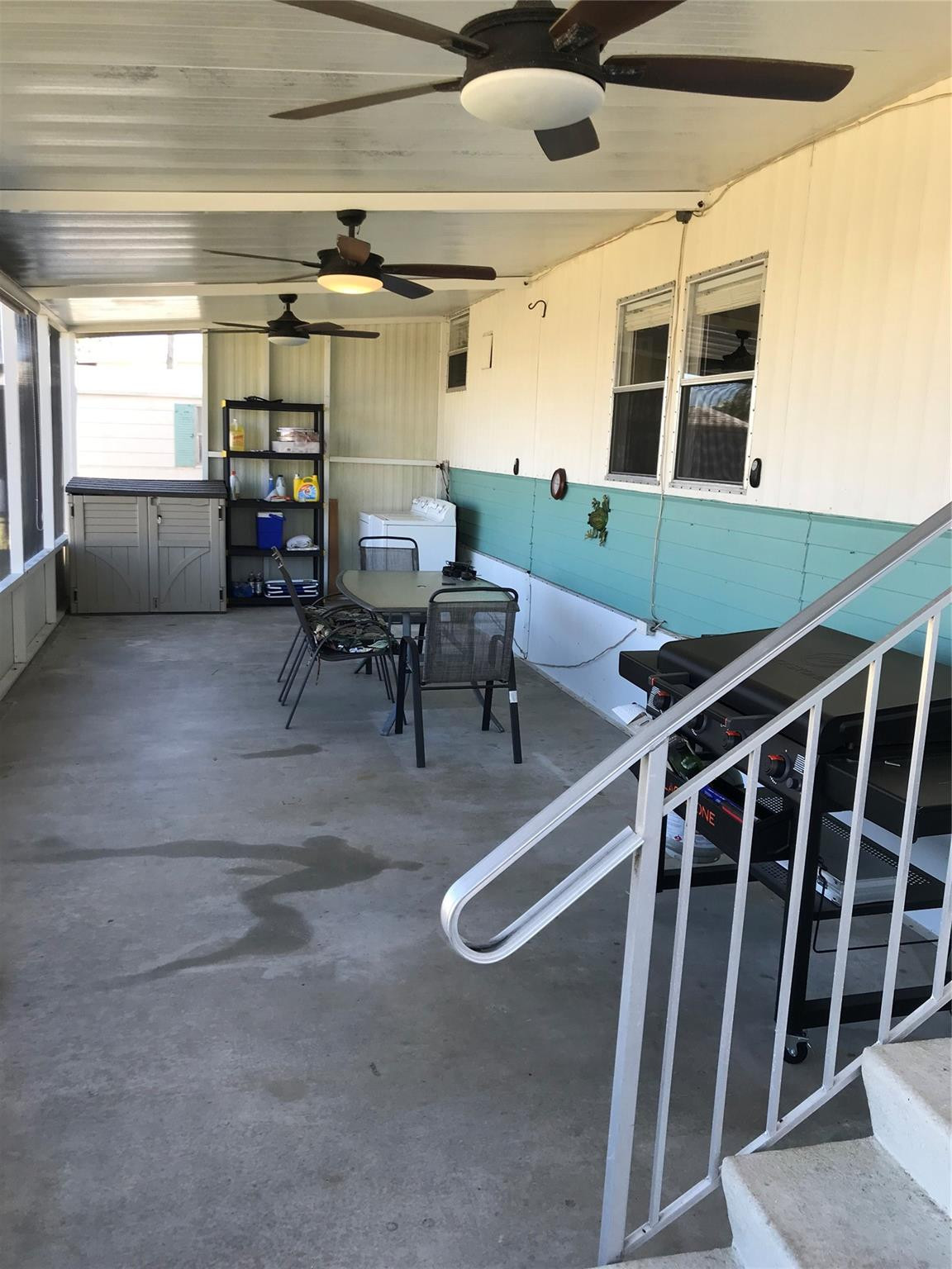 1379 Chobee Street Okeechobee, FL 34974 - Photo 9 of 13 a view of a porch with chairs and a window