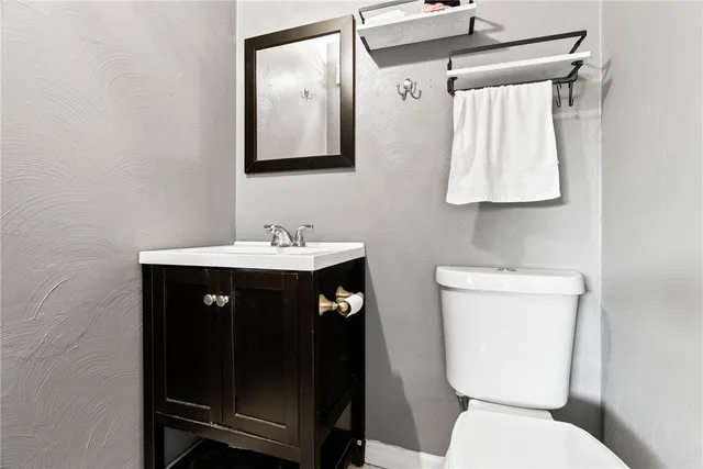 a bedroom with furniture and a dresser