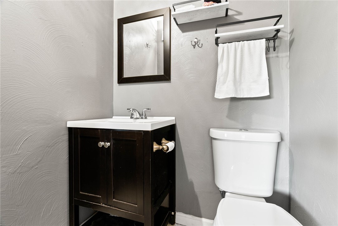302 Cole Street Corpus Christi, TX 78404 - Photo 18 of 40 a bathroom with a sink a toilet and mirror