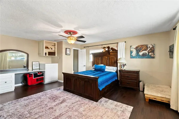 an empty room with window and wooden floor