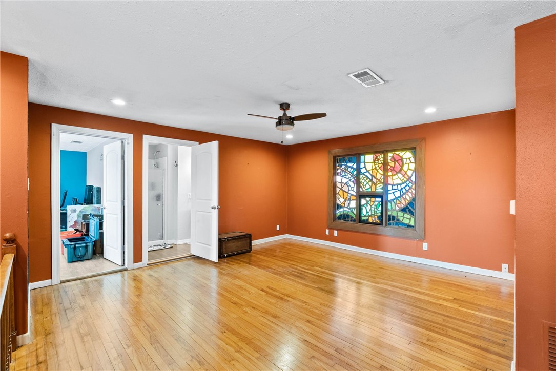 302 Cole Street Corpus Christi, TX 78404 - Photo 20 of 40 an empty room with window and wooden floor