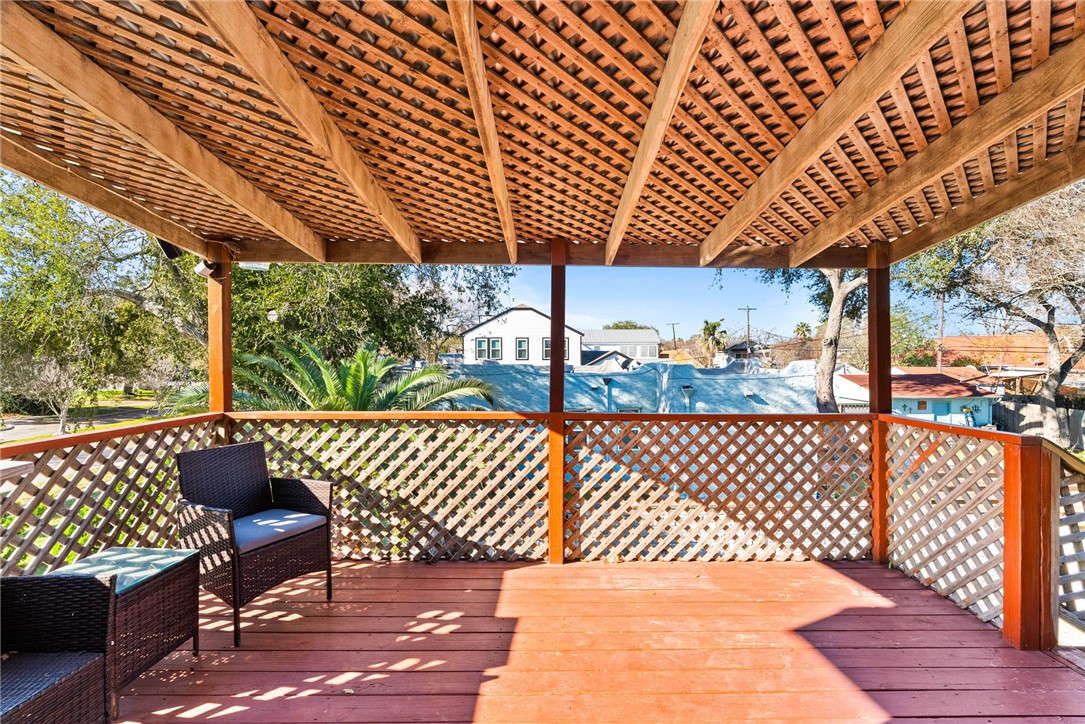302 Cole Street Corpus Christi, TX 78404 - Photo 26 of 40 a view of a roof deck with wooden fence and wooden floor