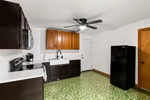 a open kitchen with a table and chairs in it