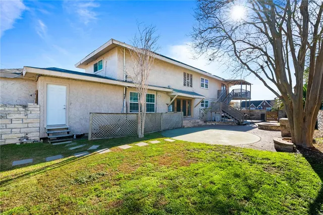 a view of a backyard with a patio