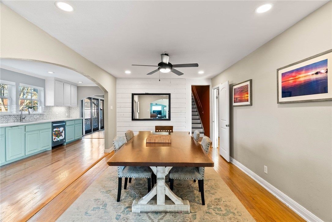 302 Cole Street Corpus Christi, TX 78404 - Photo 8 of 40 a dining room with wooden floor and a chandelier