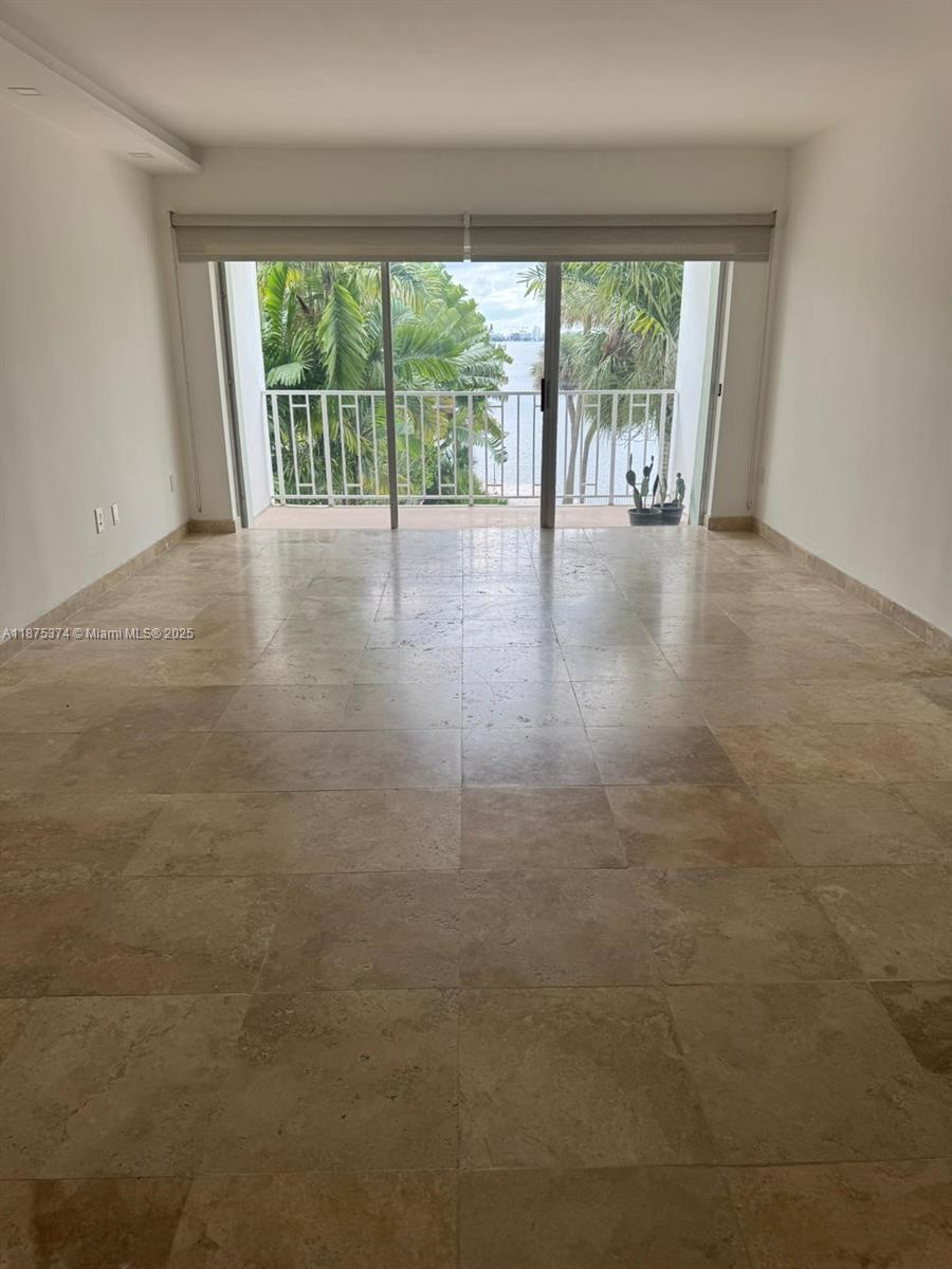 500 Bayview Drive, Unit 230 Sunny Isles Beach, FL 33160 - Photo 13 of 48 wooden floor in an empty room with a large window