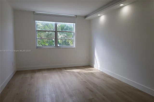 a white toilet sitting next to a bathroom