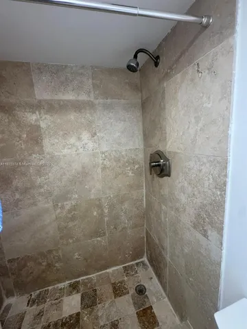 a view of lobby with a chandelier and living room