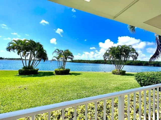 a kitchen with stainless steel appliances a stove microwave and refrigerator
