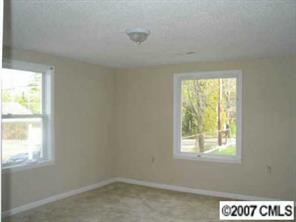 605 Morningside Road Charlotte, NC 28214 - Photo 3 of 8 a view of an empty room with a window