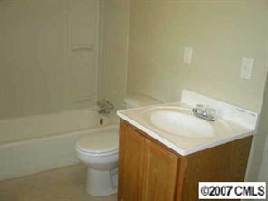 605 Morningside Road Charlotte, NC 28214 - Photo 7 of 8 a bathroom with a sink a toilet and a bathtub