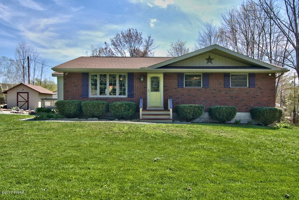 1058 Rosengrant Road Lake Ariel, PA 18436 - Photo 41 of 47 a front view of a house with a yard