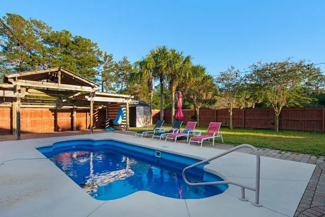 a front view of house with yard and outdoor seating