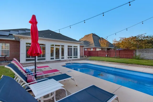 a view of a house with swimming pool