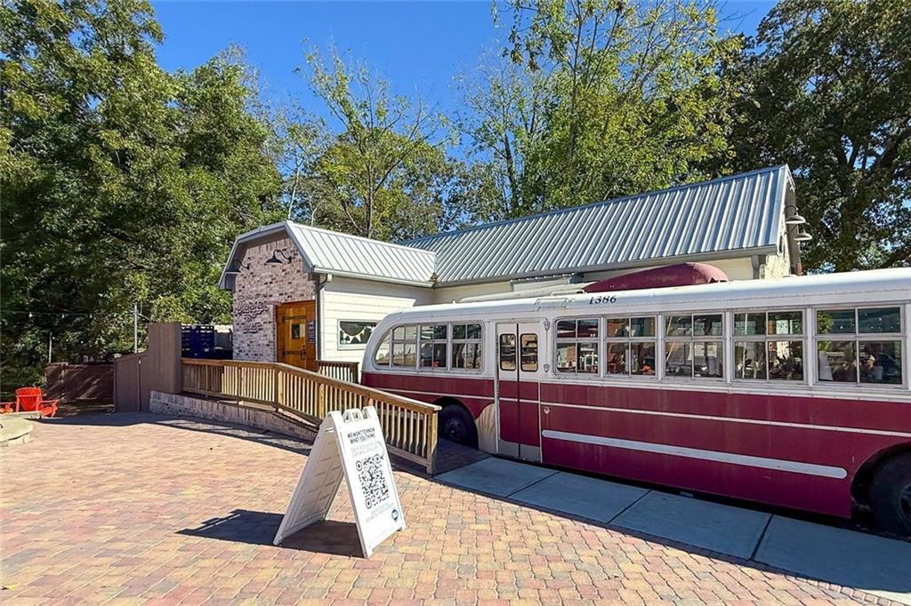 255 Lowry Street Ball Ground, GA 30107 - Photo 28 of 29 a front view of a house with a garden