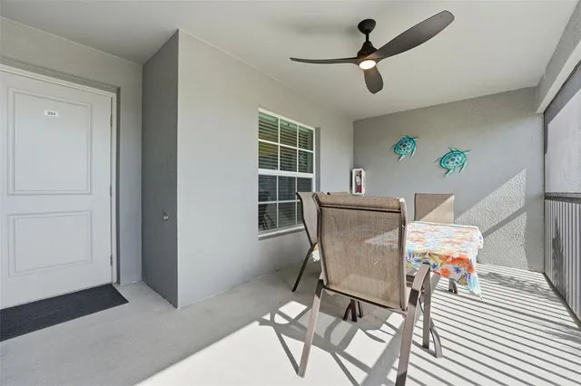a view of a swimming pool and lounge chairs