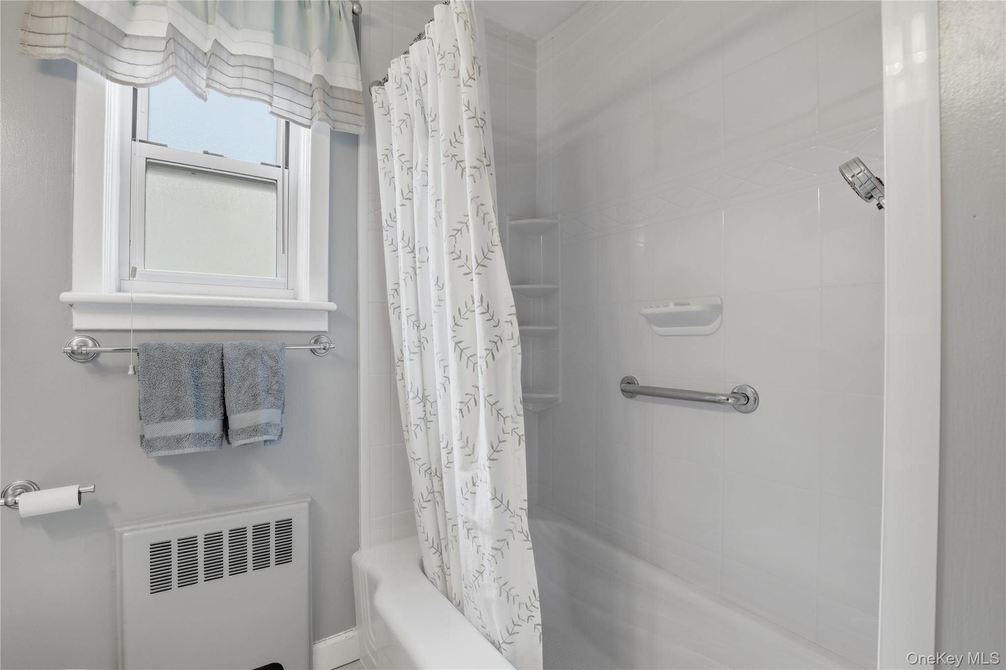 352 North State Road, Unit 1H Briarcliff Manor, NY 10510 - Photo 14 of 20 a bathroom with a bathtub and shower