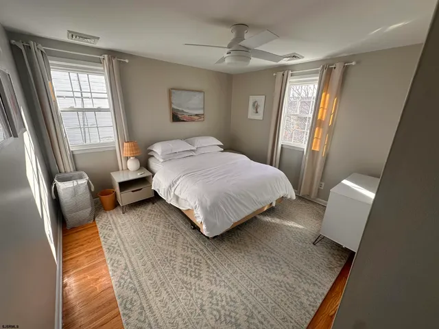 a view of a room with furniture and window