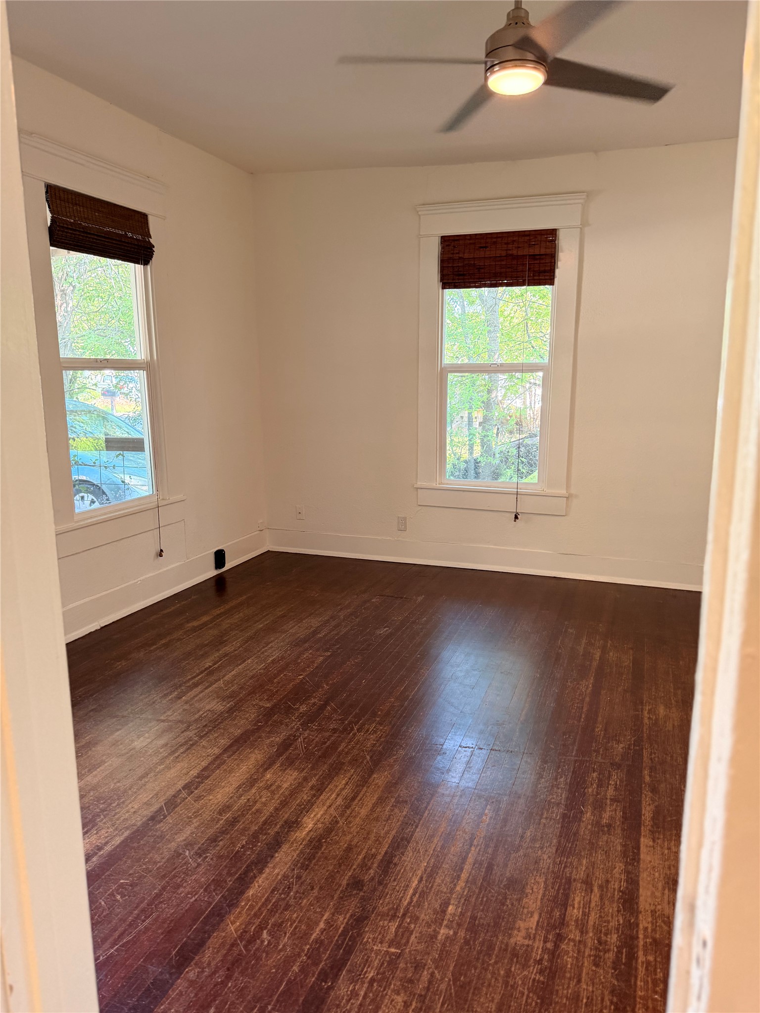 1136 Eleanor Street Austin, TX 78721 - Photo 22 of 30 Well-lit room features durable hardwood floors and a convenient ceiling fan for year-round comfort.
