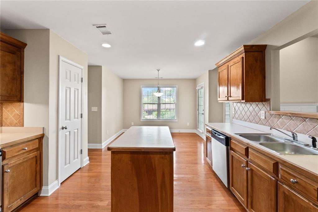 241 Red Bud Road Jefferson, GA 30549 - Photo 20 of 43 a kitchen with stainless steel appliances granite countertop a sink stove and cabinets