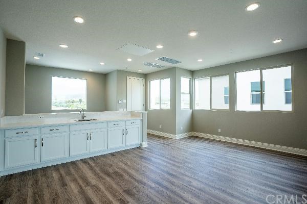 146 Spectacle Irvine, CA 92618 - Photo 19 of 57 a view of an empty room with wooden floor and a window