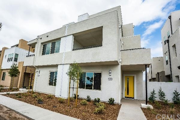 146 Spectacle Irvine, CA 92618 - Photo 2 of 57 a front view of a house with a porch