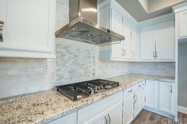 146 Spectacle Irvine, CA 92618 - Photo 22 of 57 a stove top oven sitting inside of a kitchen