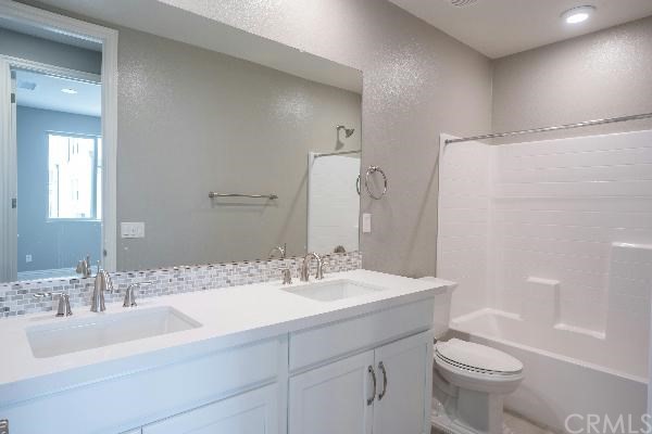 146 Spectacle Irvine, CA 92618 - Photo 29 of 57 a bathroom with a sink toilet and shower
